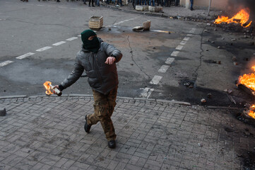 Person attenting in the city riot - obrazy, fototapety, plakaty