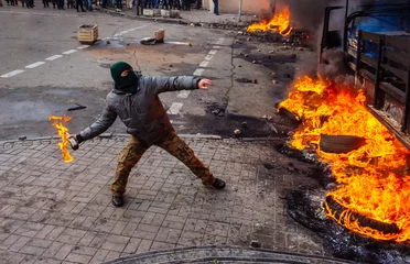 Cercles muraux Kiev Person attenting in the city riot
