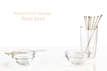 Silver needles for traditional Chinese acupuncture medicine. White background.