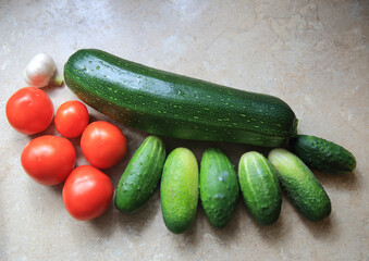 Summer harvest. Zucchini, tomatoes, cucumbers and garlic. High quality photo