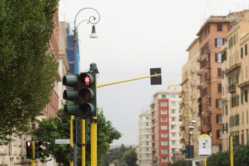 pedestrian traffic light with red light on to indicate stop