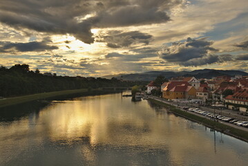 Maribor, Slovenia. Cityscape image of Maribor, Slovenia at beautiful summer sunset with reflection of the city in Drava River.