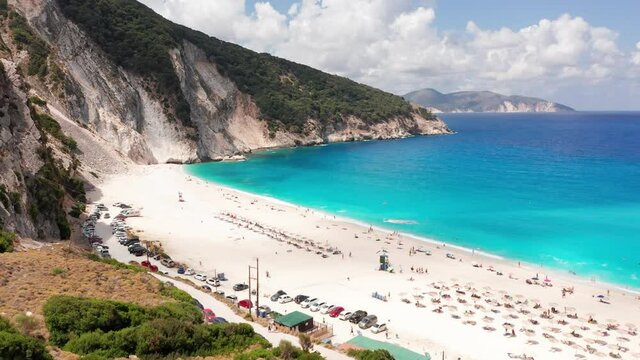 Aerial view of  umbrellas by the exotic turquoise sea of Myrtos beach at Kefalonia island, Greece