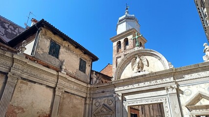 carved marble portal of church and glow