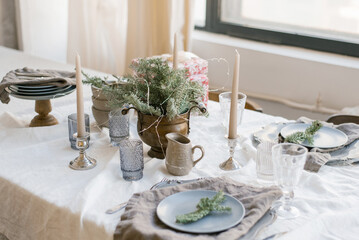 Beautiful table setting with Christmas decorations in living room