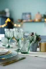 Green glass glasses for a festive Christmas dinner