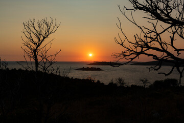 Amazing sunset on the croatian side of adriatic coast at the shore of Rogoznica, with numerous distant islands lit by the dying sun