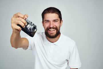 man holding camera professional photographer home light background