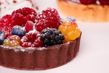 Fresh cake with raspberries in powdered sugar. Dessert in a cafe for breakfast.