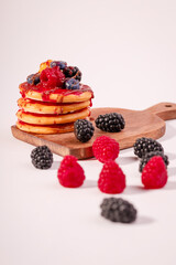 Fresh cake with raspberries in powdered sugar. Dessert in a cafe for breakfast.