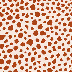 Abstract spot animal skin seamless repeat pattern. Random placed, irregular vector stains all over surface print on beige background.