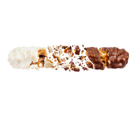 Two halves of milk and chocolate bars crushed in air on a white background