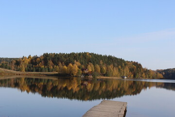 Nature of Karelia: lake and autumn forest on the other side