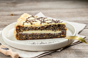 Poppy Seed Cake on the white plate on wooden table