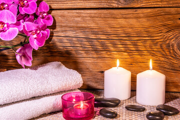 Obraz na płótnie Canvas Spa, zen basalt stones, towels, candles in the massage room.