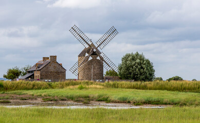 Fototapeta na wymiar Cherrueix, France.26-23-2021. Old windmill near the ocean at Cherrueix in Brittany. France.