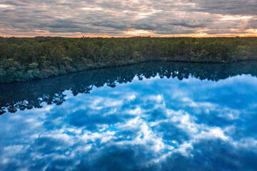 Obraz premium aerial image of a lake during sunset