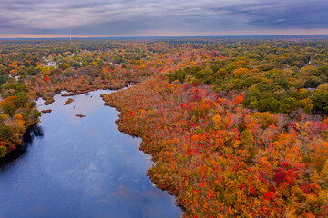 overcast aerial image of a fall lake