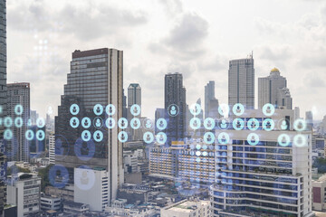 Social media icons hologram over panorama city view of Bangkok, Southeast Asia. The concept of...