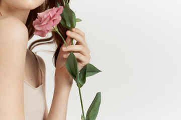 Fototapeta na wymiar attractive woman flowers in hands posing charm lifestyle glamor
