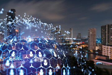 Glowing social media icons on night panoramic city view of Bangkok, Southeast Asia. The concept of networking and establishing new connections between people in businesses. Double exposure.