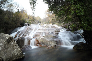 waterfalls of a mountain river in autumn focus selected