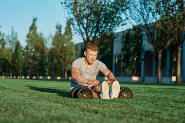 athletic man with dumbbells in the park exercise motivation