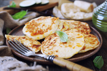 Zucchini fritters. Vegetable squash pancakes with cheese and olive oil