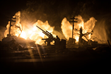 War Concept. Military silhouettes fighting scene on war fog sky background, World War Soldiers Silhouette Below Cloudy Skyline At night. Battle in ruined city. Selective focus