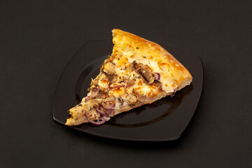 Appetizing slice of pizza on a black background