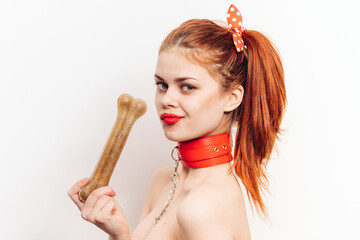 pretty woman with leash around her neck dog bone costume posing