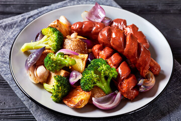 Sausage with broccoli, potato and onion, top view