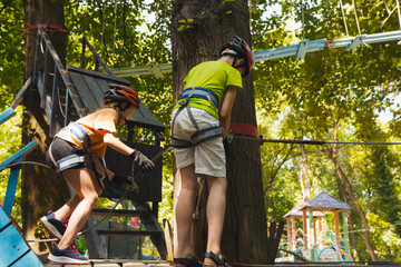 The children in helmets are preparing for the descent