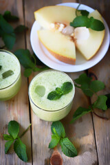 Smoothie melon mint in glasses. Refreshing drink. Diet food.