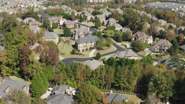 Flying over upscale residential subdivision on a beautiful sunny day of fall in the east coast of USA.