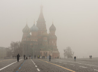 Moscow, Russia, Nov 02, 2021: Heavy fog.  Red square. St. Basil's catherdral. People walking