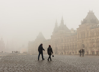 Moscow, Russia, Nov 02, 2021: Heavy fog.  Red square near GUM (Main department store) People walking
