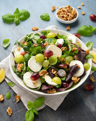 Italian salad with goat cheese, grapes and walnuts. Healthy Food