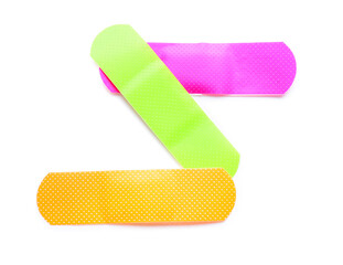 Adhesive medical plasters on white background