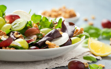 Italian salad with goat cheese, grapes and walnuts. Healthy Food