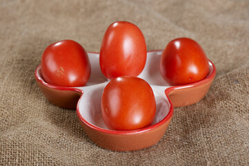 red tomatoes in dish