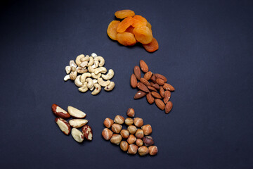Mix of dry fruits containing almonds, walnuts, raisins and dried figs and dried peaches. Healthy food concept