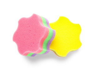 Different star shaped bath sponges on white background