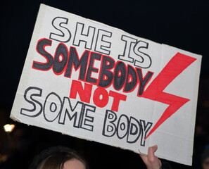 Krakow, Poland - November 7 2021: Banner with slogan SHE IS SOMEBODY NOT SOME BODY to support women...