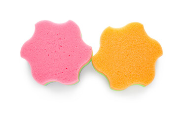 Pink and orange star shaped bath sponges on white background