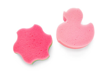 Star and duck shaped bath sponges on white background