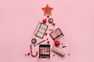 Beautiful Christmas tree made of makeup cosmetics and decor on pink background