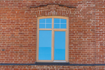 Fototapeta na wymiar Brick wall from old bricks and a window.