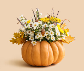 Beautiful autumn bouquet in pumpkin on light background