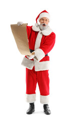 Surprised Santa Claus reading wish list on white background
